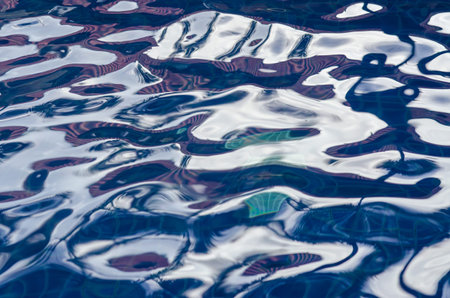 Resort pool water ripples in eveningの写真素材
