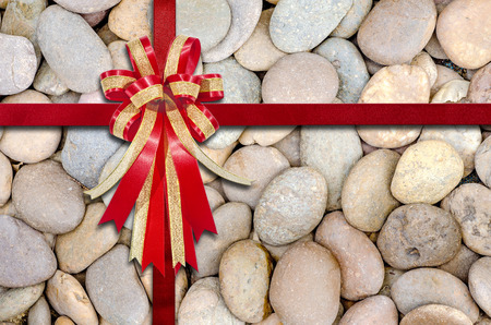 Red Ribbon on stone  for background. Hi-res, close upの写真素材