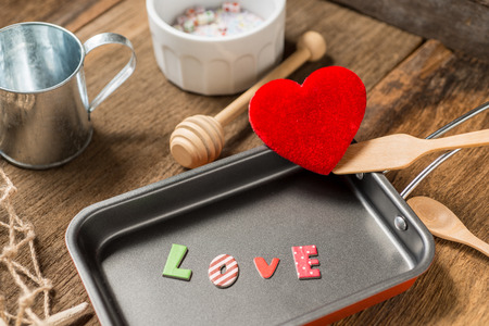 the word love in frying pan for Love or Heart Healthy Cooking Conceptの写真素材