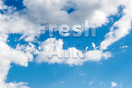 Fresh air message written on  blue sky with cloud closeupの写真素材