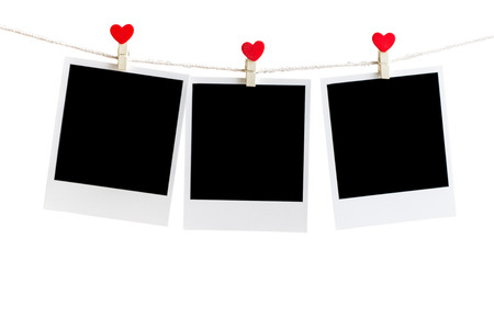Three Old picture frame hanging on the clothesline over white,Clipping path for insert Photoの写真素材