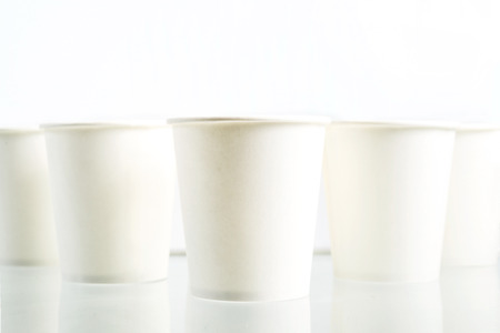 Empty white Disposable paper cups on white background  , isolated on whiteの写真素材