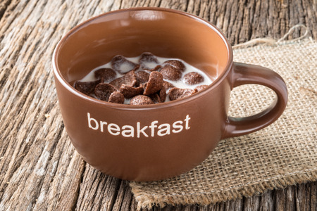 Studio Shot of Chocolate cornflakes on wooden backgroundの写真素材