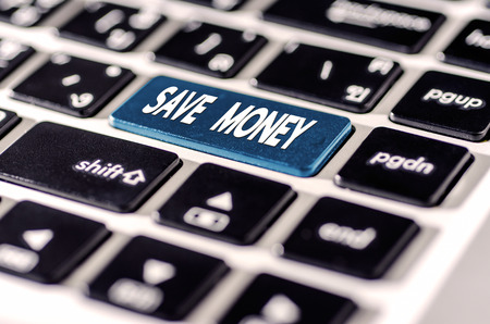 Studio Shot save money for investment concept with a  button on computer keyboardの写真素材