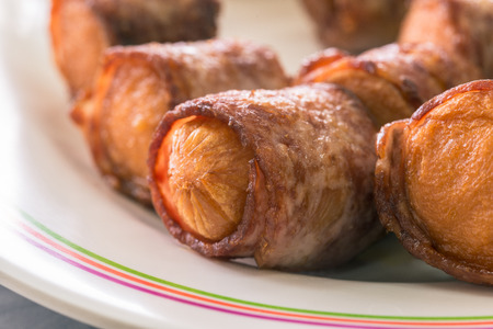 Sausages wrapped in bacon,close up,se;ective focusの写真素材