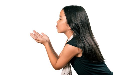 Sweet little girl blowing kisses,Isolated over white with clipping path