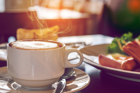 closeup of Coffee cup with a Breakfast at coffee shopの写真素材