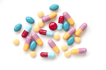 Colorful pill tablets on white backgroundの写真素材