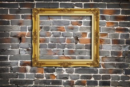 Golden Frame on Old Brick Wall Backgroundの写真素材