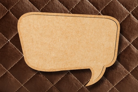 Blank Speech Bubble on Brown leather Backgroundの写真素材