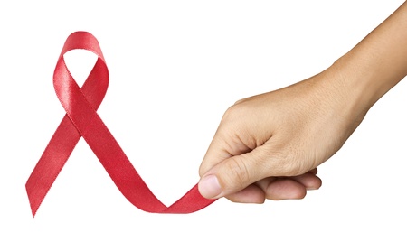 Hand Make Red Ribbon for AIDS symbol on white backgroundの写真素材