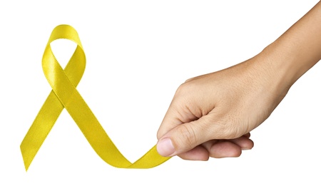 Hand Make Yellow Ribbon for Bone Cancer symbol on white backgroundの写真素材