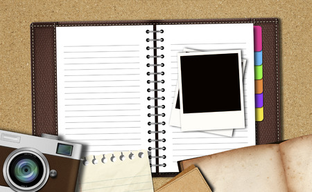 Workspace with notebook ,classic camera,instant photos, note paperの写真素材