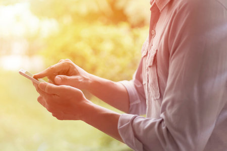 a casual man using smartphone with blurry background