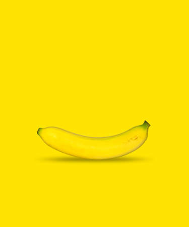 a banana on yellow backgroundの写真素材