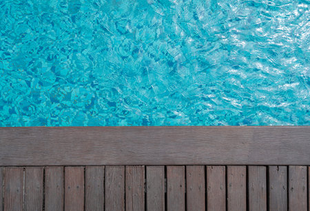 Swimming pool and wooden deck backgroundsの写真素材