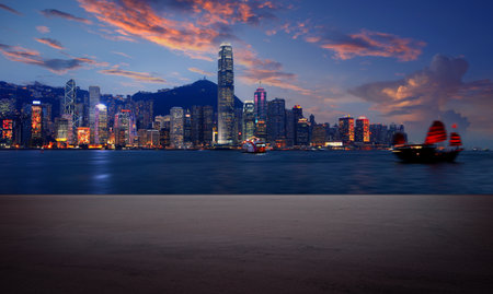 Panorama of Hong Kong Skyline at night with empty asphalt floor spaceのeditorial素材