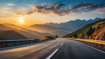 Highway in the mountains at sunset. Beautiful summer landscape with asphalt road.の素材