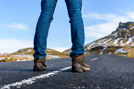 Adult stand in the middle of the road getting ready the explore the dream destination