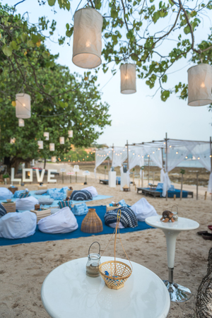 Beautiful table set up by the beachの写真素材