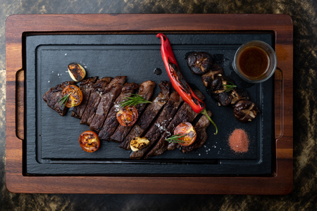 Sliced grilled beef in beautiful trayの写真素材