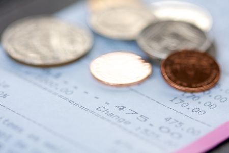 Restaurant bill and tip: selective focus