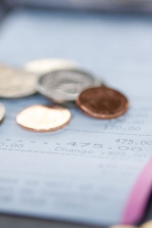 Restaurant bill and tip: selective focusの写真素材