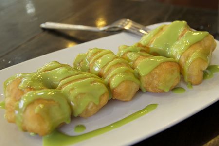 fried dough chinese bread with green sweet sauceの写真素材