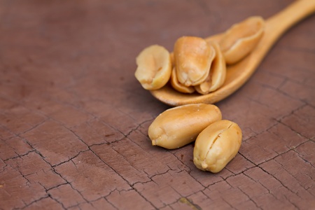 Peanuts closeup on grunge earth tone backgroundの写真素材
