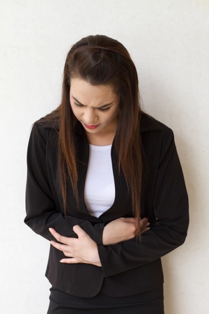 menstruation pain or stomach trouble of female business executiveの写真素材