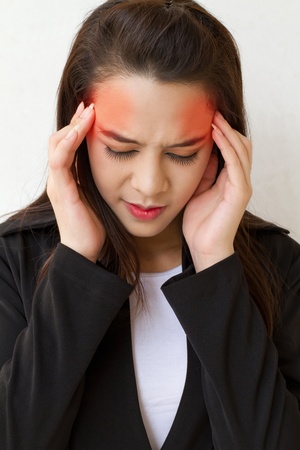 woman with headache, migraine, stress, insomnia, hangover with red danger accentの写真素材