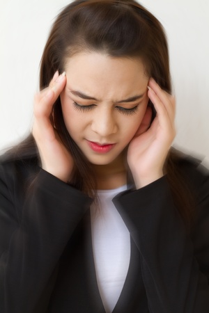 woman with headache, migraine, stress, insomnia, hangover, dizziness with vertigo accentの写真素材