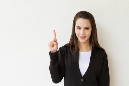woman business executive showing 1 or one finger hand gestureの写真素材