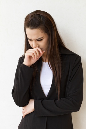 sick woman with cough and throat problem  の写真素材
