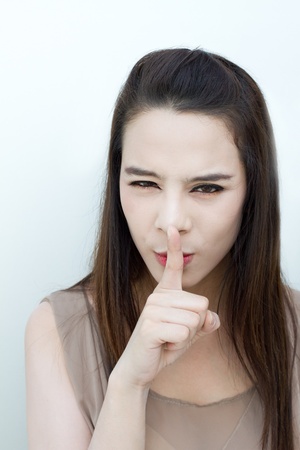 Shh!! silent hand sign from womanの写真素材