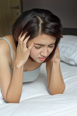 woman with headache, migraine, stress, insomnia, hangoverの写真素材