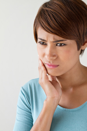 worry woman with toothache, oral problem, anxiety moodの写真素材