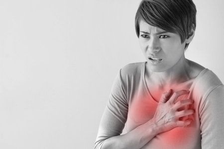 sick woman with sudden heart attack symptom