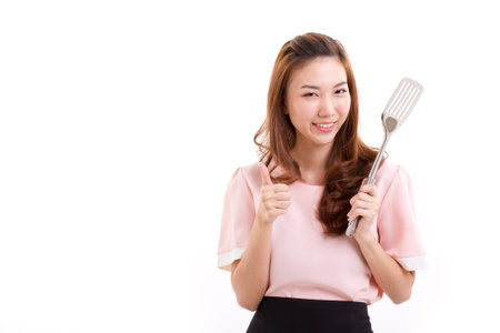 cooking woman giving thumb upの写真素材