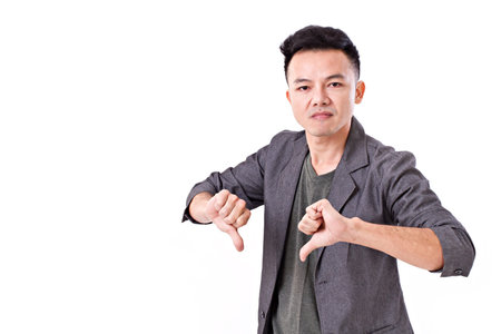 man giving two thumbs down gestureの写真素材