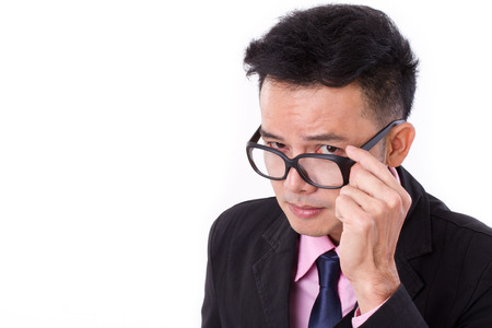 curious businessman looking at youの写真素材