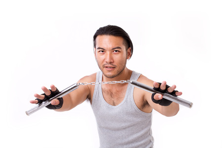 asian Kung Fu man with chainsticks or nunchakuの写真素材