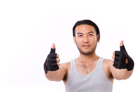 fitness man showing thumb up gestureの写真素材