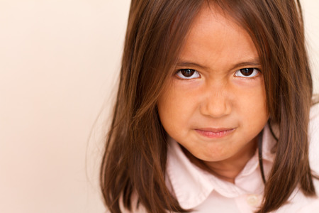 Portrait of angry, upset little girlの写真素材