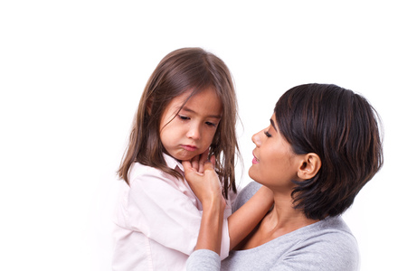 mother comforting crying daughter, concept of caring parent