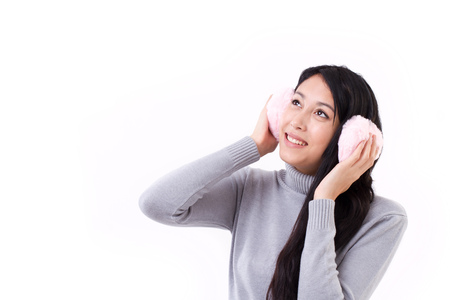 happy, smiling asian-caucasian woman looking upの写真素材