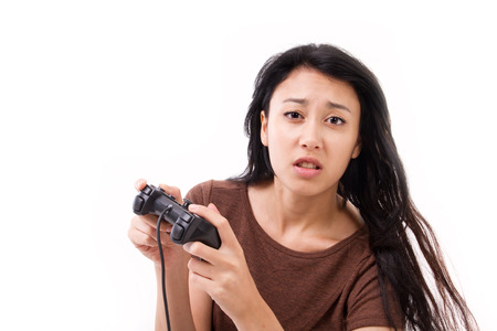 stressed, exited female gamer isolatedの写真素材