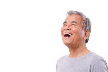 laughing, happy senior old man looking upの写真素材
