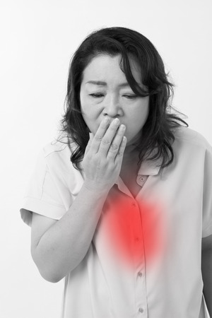 sick woman suffers from cold, flu, respiratory issueの写真素材