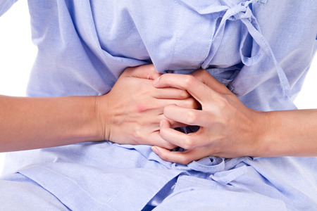 woman patient suffering from stomachacheの写真素材